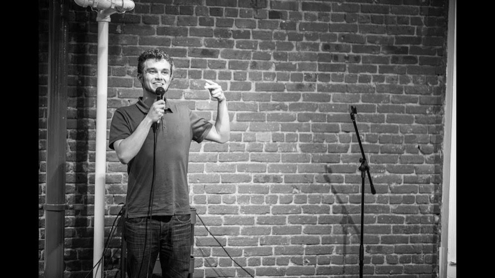 Toli speaking on stage
